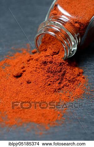 Picture - Paprika powder in glass bottle, chili, chili powder ( Capsicum annuum). Fotosearch