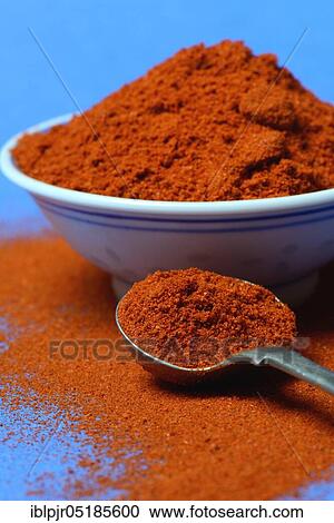 Stock Image - Paprika powder in spoon, Capsicum annuum, chili, chili powder. Fotosearch