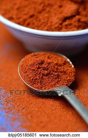 Stock Image - Paprika powder in spoon, Capsicum annuum, chili, chili powder. Fotosearch