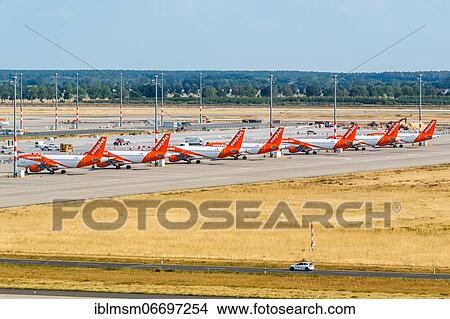 Parked EasyJet aircraft Coronavirus Corona Virus COVID-19 Berlin Brandenburg BER Airport aerial view in Berlin, Germany, Europe View Large Photo Image Picture - Parked EasyJet aircraft Coronavirus Corona Virus COVID-19 Berlin Brandenburg BER Airport aerial view in Berlin, Germany, Europe. Fotosearch