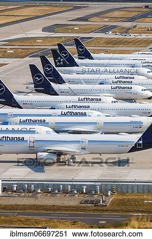 Stock Image - Parked Lufthansa aircraft Coronavirus Corona Virus COVID-19 Airport Berlin Brandenburg BER aerial photo in Berlin, Germany, Europe. Fotosearch