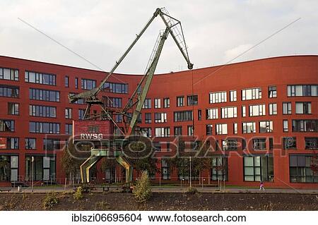 Partial view of the State Archive of North Rhine-Westphalia with a crane in the inner harbour, Duisburg, Ruhr area, North Rhine-Westphalia, Germany, Europe View Large Photo Image Picture - Partial view of the State Archive of North Rhine-Westphalia with a crane in the inner harbour, Duisburg, Ruhr area, North Rhine-Westphalia, Germany, Europe. Fotosearch