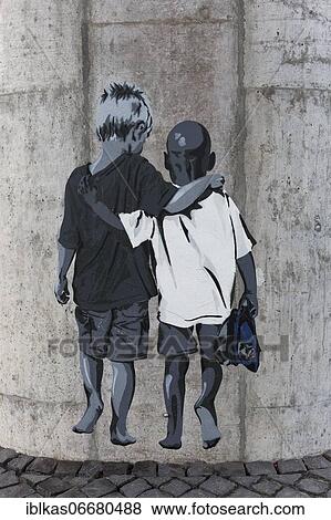 Paste-up, white boy hugs colored boy, two friends, streetart against racism, Düsseldorf, North Rhine-Westphalia, Germany, Europe View Large Photo Image Stock Photo - Paste-up, white boy hugs colored boy, two friends, streetart against racism, Düsseldorf, North Rhine-Westphalia, Germany, Europe. Fotosearch