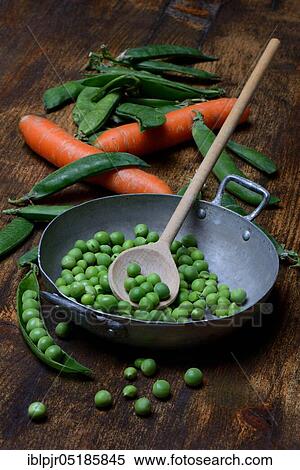 Peas ( Pisum sativum) green in bowl with cooking spoon View Large Photo Image Stock Photography - Peas ( Pisum sativum) green in bowl with cooking spoon. Fotosearch