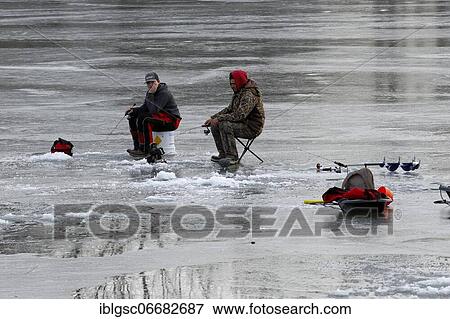 Stock Photo - People fishing on frozen river, Province of Quebec, Canada, North America. Fotosearch