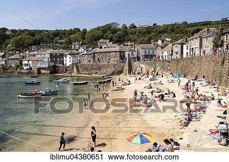 People on beach, Mousehole village, Cornwall, England View Large Photo Image Stock Image - People on beach, Mousehole village, Cornwall, England. Fotosearch
