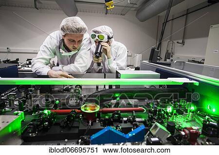 PhD student during his research work adjusting his experimental setup, laser laboratory of Prof. Georg Pretzler's working group for laser and plasma physics at Heinrich Heine University, Düsseldorf, North Rhine-Westphalia, Germany, Europe View Large Photo Image Stock Image - PhD student during his research work adjusting his experimental setup, laser laboratory of Prof. Georg Pretzler's working group for laser and plasma physics at Heinrich Heine University, Düsseldorf, North Rhine-Westphalia, Germany, Europe. Fotosearch