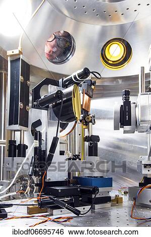 PhD student during his research work adjusting his experimental setup, laser laboratory of Prof. Georg Pretzler's group for laser and plasma physics at Heinrich-Heine-University, Düsseldorf, North Rhine-Westphalia, Germany, Europe View Large Photo Image Stock Photograph - PhD student during his research work adjusting his experimental setup, laser laboratory of Prof. Georg Pretzler's group for laser and plasma physics at Heinrich-Heine-University, Düsseldorf, North Rhine-Westphalia, Germany, Europe. Fotosearch