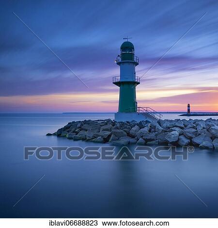 Stock Image - Pier light Warnemünde at dawn, lighthouses on the west and east pier, Warnemünde, Hanseatic City of Rostock, Mecklenburg-Western Pomerania, Germany, Europe. Fotosearch