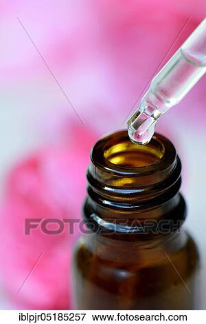 Pipette with drops and brown bottle, rose water View Large Photo Image Stock Photo - Pipette with drops and brown bottle, rose water. Fotosearch