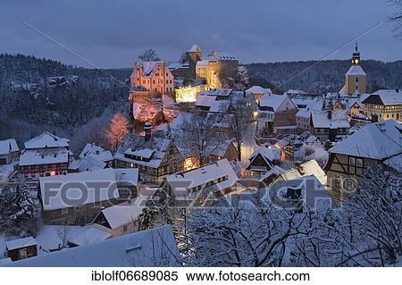 Place Hohnstein with rock castle at snow, blue hour, Saxony, Germany, Europe View Large Photo Image Stock Photography - Place Hohnstein with rock castle at snow, blue hour, Saxony, Germany, Europe. Fotosearch
