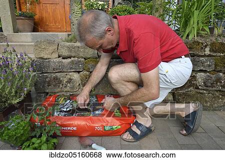 Stock Photo - Planting bag with potting soil. Fotosearch