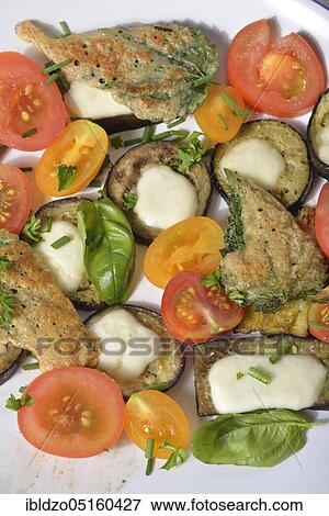 Plate with tomatoes, aubergines, baked nettle leaves View Large Photo Image Stock Photo - Plate with tomatoes, aubergines, baked nettle leaves. Fotosearch
