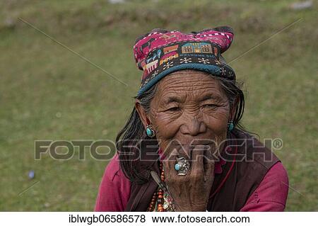 Portrait, elderly woman with turquoise earring and finger ring, Dolpo, Nepal, Asia View Large Photo Image Stock Photo - Portrait, elderly woman with turquoise earring and finger ring, Dolpo, Nepal, Asia. Fotosearch