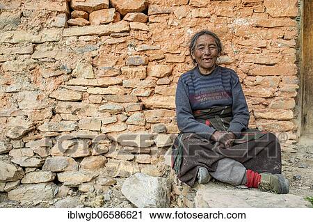 Portrait, friendly elderly woman in front of a house wall, Dolpo, Nepal, Asia View Large Photo Image Stock Image - Portrait, friendly elderly woman in front of a house wall, Dolpo, Nepal, Asia. Fotosearch