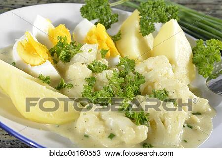 Potatoes and cauliflower in herb sauce View Large Photo Image Stock Image - Potatoes and cauliflower in herb sauce. Fotosearch