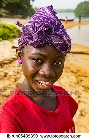 Stock Image - Pretty young girl, in a local village, Buchanan, Liberia, Africa. Fotosearch