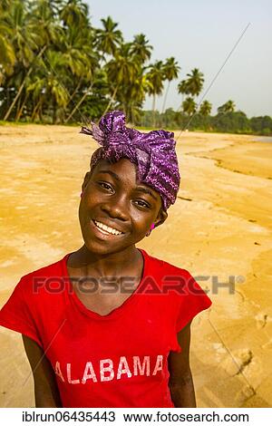 Stock Image - Pretty young girl, in a local village, Buchanan, Liberia, Africa. Fotosearch
