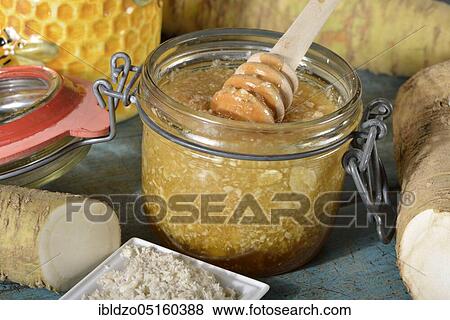 Stock Photo - Production horseradish syrup (Cochlearia armoracia) with honey, horseradish. Fotosearch