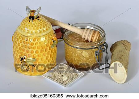 Stock Photography - Production horseradish syrup (Cochlearia armoracia) with honey, horseradish. Fotosearch