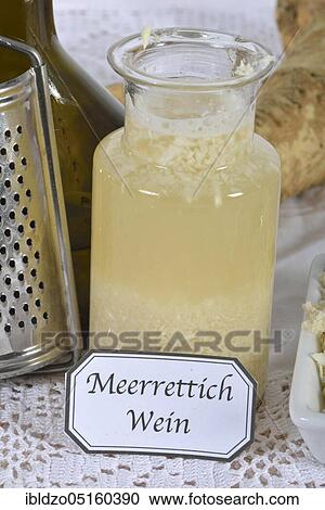 Stock Image - Production Horseradish wine (Cochlearia armoracia), horseradish. Fotosearch