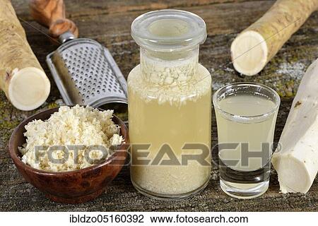 Stock Image - Production Horseradish wine (Cochlearia armoracia), horseradish. Fotosearch