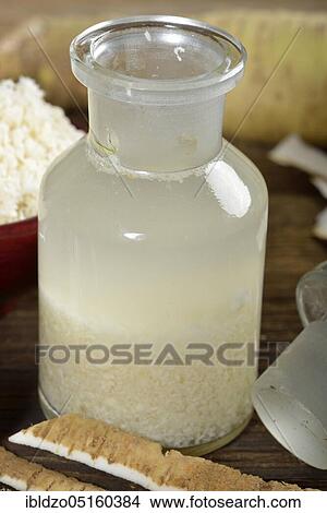Picture - Production of horseradish tincture (Cochlearia armoracia), horseradish. Fotosearch