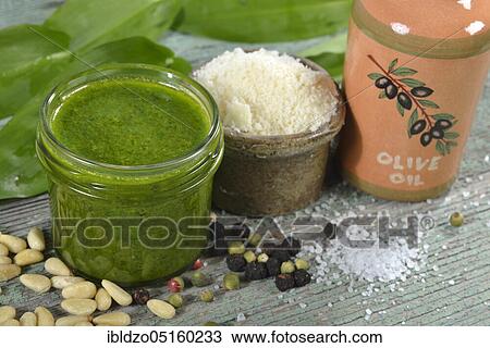 Production wild garlic pesto (Allium ursinum), wild garlic pesto, pine nuts, Parmesan cheese View Large Photo Image Stock Image - Production wild garlic pesto (Allium ursinum), wild garlic pesto, pine nuts, Parmesan cheese. Fotosearch