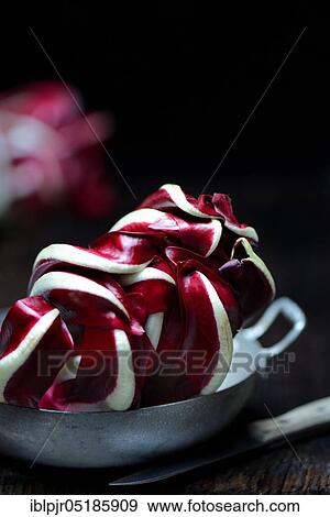 Radicchio in dish and kitchen knife, Radicchio Rosso di Treviso, red Chicory View Large Photo Image Stock Photo - Radicchio in dish and kitchen knife, Radicchio Rosso di Treviso, red Chicory. Fotosearch