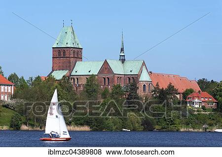Ratzeburg Cathedral, Domsee lake with sailboat in front, Ratzeburg, Schleswig-Holstein, Germany, Europe View Large Photo Image Stock Photo - Ratzeburg Cathedral, Domsee lake with sailboat in front, Ratzeburg, Schleswig-Holstein, Germany, Europe. Fotosearch