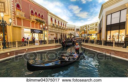Stock Photo - Replica of Venice, tourists in Venetian gondolas on canal, artificial sky, The Venetian Resort Hotel Casino, Las Vegas, Nevada, USA, North America. Fotosearch