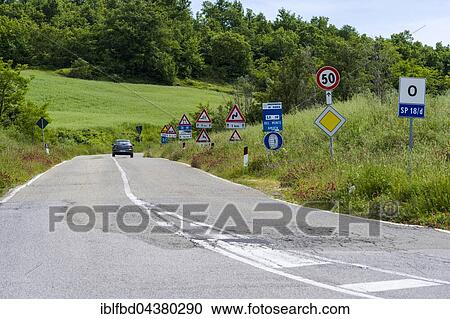 Road flanked bei many traffic signs, Castiglione d’Orcia, Val d’Orcia, Tuscany, Italy, Europe View Large Photo Image Stock Image - Road flanked bei many traffic signs, Castiglione d’Orcia, Val d’Orcia, Tuscany, Italy, Europe. Fotosearch