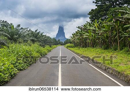 Road leading to the unusal monolith, Pico Cao Grande, east coast of Sao Tome, Sao Tome and Principe, Atlantic Ocean, Africa View Large Photo Image Picture - Road leading to the unusal monolith, Pico Cao Grande, east coast of Sao Tome, Sao Tome and Principe, Atlantic Ocean, Africa. Fotosearch