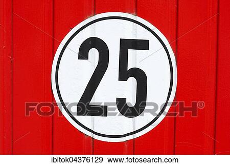 Stock Photo - Road sign speed limit 25 Km/h on red wood wall, Mecklenburg-Western Pomerania, Germany, Europe. Fotosearch