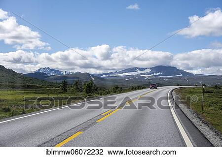 Stock Image - Road through tundra, country road, Dovrefjell National Park, Oppdal, Norway, Europe. Fotosearch