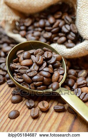 Roasted coffee beans in ladle View Large Photo Image Stock Photo - Roasted coffee beans in ladle. Fotosearch