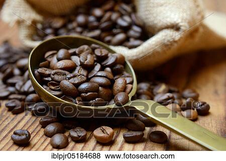 Roasted coffee beans in ladle View Large Photo Image Stock Photo - Roasted coffee beans in ladle. Fotosearch