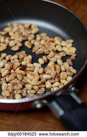 Roasted seeds ( Pinus pinea) in frying pan View Large Photo Image Stock Image - Roasted seeds ( Pinus pinea) in frying pan. Fotosearch