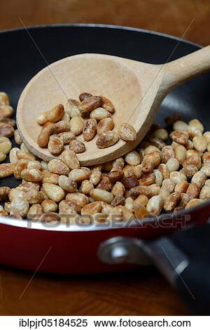 Roasted seeds ( Pinus pinea) in frying pan View Large Photo Image Stock Photography - Roasted seeds ( Pinus pinea) in frying pan. Fotosearch