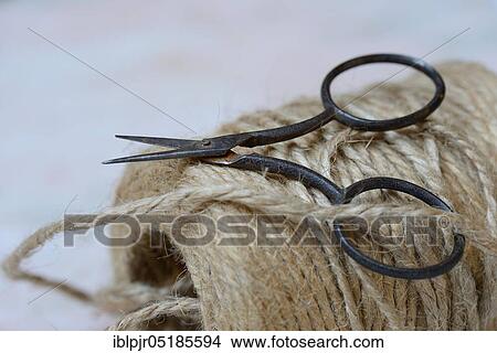Roll of jute string and scissors, jute thread, jute View Large Photo Image Picture - Roll of jute string and scissors, jute thread, jute. Fotosearch