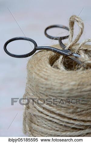 Stock Photography - Roll of jute string and scissors, jute thread, jute. Fotosearch