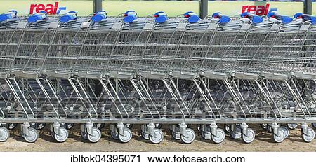 Row of shopping carts in front of shopping centre, Bremen, Germany, Europe View Large Photo Image Stock Image - Row of shopping carts in front of shopping centre, Bremen, Germany, Europe. Fotosearch