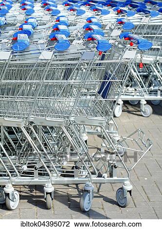 Stock Image - Row of shopping carts in front of shopping centre, Bremen, Germany, Europe. Fotosearch