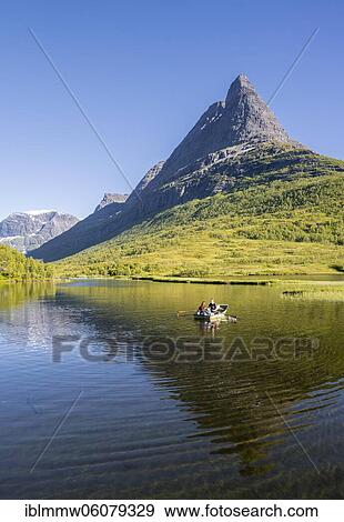 Ruterboat on lake Litlvatnet in the high valley Innerdalen, mountain Innerdalstårnet, Trollheimen Mountain Area, Sunndal, Møre og Romsdal, Vestlandet, Norway, Europe View Large Photo Image Stock Photo - Ruterboat on lake Litlvatnet in the high valley Innerdalen, mountain Innerdalstårnet, Trollheimen Mountain Area, Sunndal, Møre og Romsdal, Vestlandet, Norway, Europe. Fotosearch