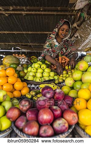 S ales woman on her fruit stall, Abeche, Chad, Africa View Large Photo Image Picture - S ales woman on her fruit stall, Abeche, Chad, Africa. Fotosearch