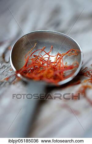 Stock Photograph - Saffron threads in spoon, saffron thread. Fotosearch