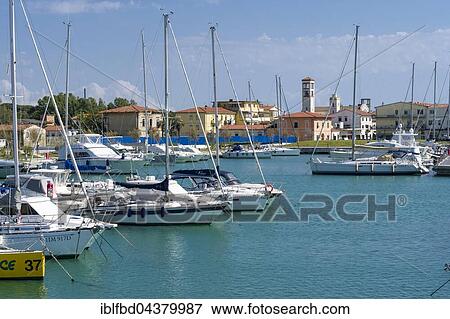 Sailing and motor boats are anchored in the harbour, Marina di Pisa, Tuscany, Italy, Europe View Large Photo Image Stock Photo - Sailing and motor boats are anchored in the harbour, Marina di Pisa, Tuscany, Italy, Europe. Fotosearch