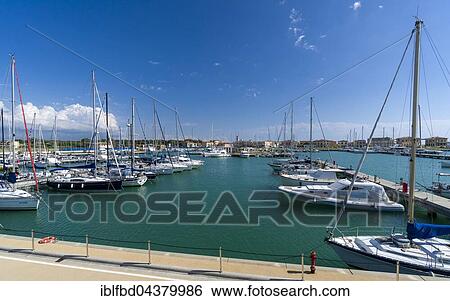 Sailing and motor boats are anchored in the harbour, Marina di Pisa, Tuscany, Italy, Europe View Large Photo Image Stock Photograph - Sailing and motor boats are anchored in the harbour, Marina di Pisa, Tuscany, Italy, Europe. Fotosearch