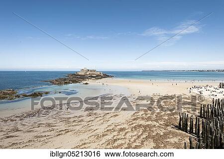 Sandy beach with groynes and Fort National, St. Malo, Brittany, France, Europe View Large Photo Image Stock Photograph - Sandy beach with groynes and Fort National, St. Malo, Brittany, France, Europe. Fotosearch