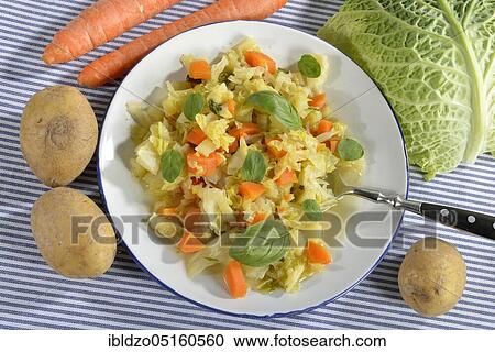 Savoy cabbage stew with carrots View Large Photo Image Stock Image - Savoy cabbage stew with carrots. Fotosearch